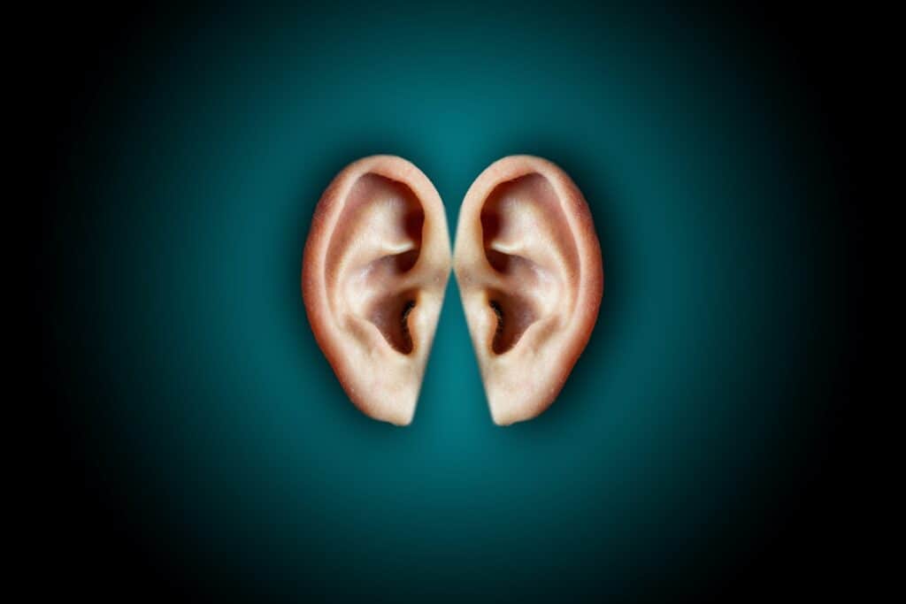 Creative shot of human ears on dark background