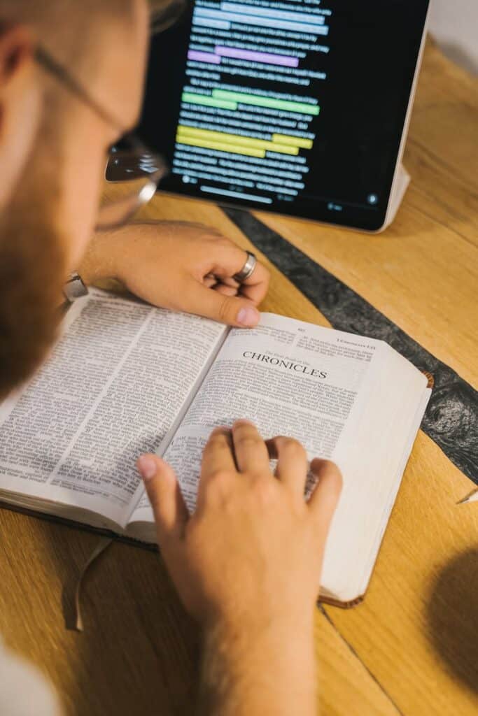 Close-Up Shot of a Person Reading a Holy Bible